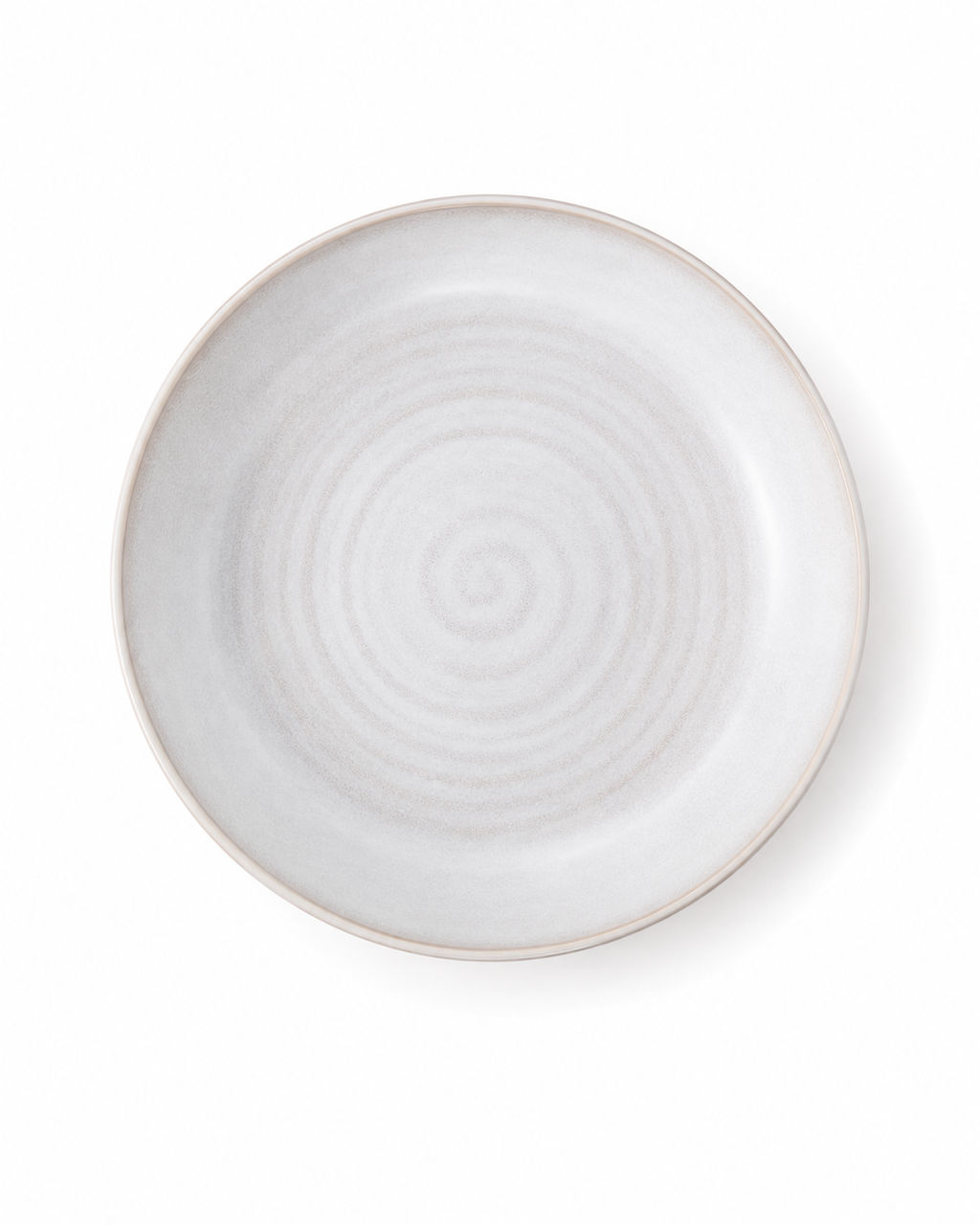 Top view of white reactive glaze ceramic pasta bowl with subtle concentric rings and a wide shallow shape