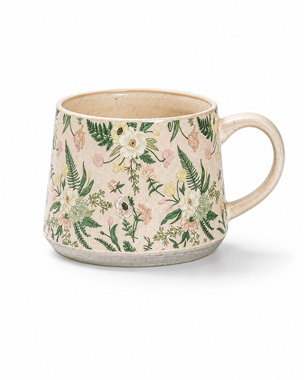 Cream floral ceramic mug with green foliage and soft pink and white wildflowers